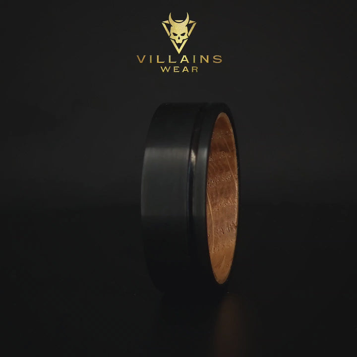 Accessible Image: Black Noir Timber Ring - A tactile view of the ring featuring black noir details and a timber inlay. This alt text provides a detailed description for those with visual impairments, emphasizing the modern and natural allure of the accessory.